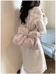 Pink polka dot pleated shoulder bag detail, cute underarm handbag with sweet pearl pendant.