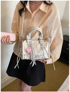 Stylish women Boston crossbody bag, fashion PU leather handbag with chic tassel and studs.