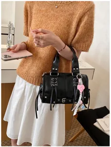 Womens black leather boston bag handbag, stylish commuting shoulder bag with strap details.