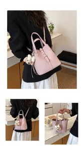 Rosa Leder Eimer Tasche mit süßem Hundeanhänger, ideal für Alltag, Arbeit und modischen Streetstyle.