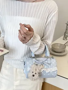 Light blue polka dot barrel bag with bow lace trim and cute puppy charm for summer daily wear