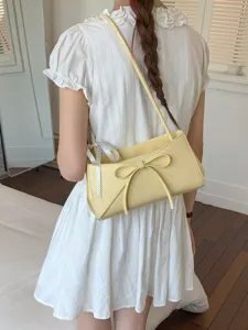 Sac à épaule baguette jaune doux pour femmes, sac bandoulière élégant avec nœud et ruban.