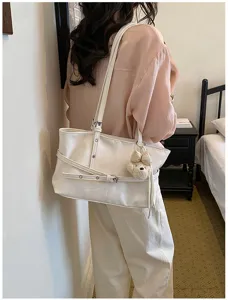 Sac cabas souple minimaliste pour femme, grande capacité, élégant sac porté épaule.