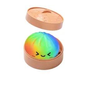 Rainbow stuffed baozi squeeze toy with steamer basket, cute stress relief sensory toy for kids.