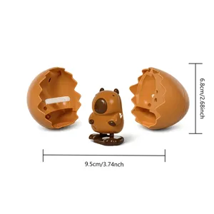 Lindo juguete de cuerda de carpincho con diseño de huevo roto, juguete interactivo.