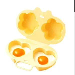 Microwave egg boiler, yellow plastic double-cavity cooker with cute flower and heart mold shapes.