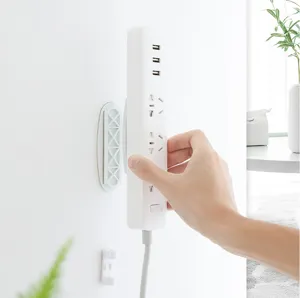 Detail view of punch-free power strip holder wall mount bracket socket fixator storage.