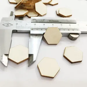 Close-up detail of natural hexagon wooden slices measured with caliper for DIY crafts.
