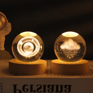 Galaxy crystal ball night light with wooden base, glowing 3D laser engraved home decor lamp.