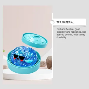 TPR squishy toy featuring glitter stars and cute shark design in steam basket detail.