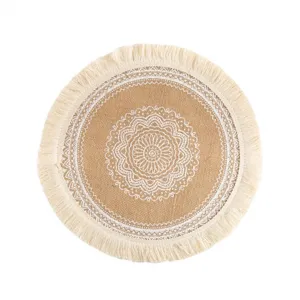 Round bohemian jute placemat with white mandala pattern and fringe. Perfect for dining.