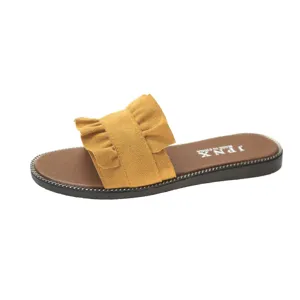 Yellow ruffle flat sandals for women, casual summer beach slip on shoes with comfortable sole.