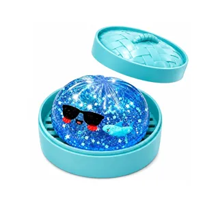 Blue glitter shark squishy toy in steamer basket, cute stress relief toy for kids and adults.