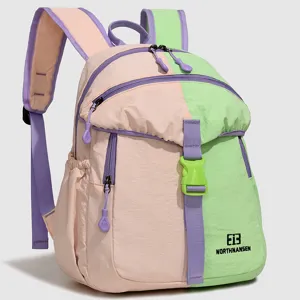 Color-block casual backpack detail showing zipper pockets, straps, and secure buckle.