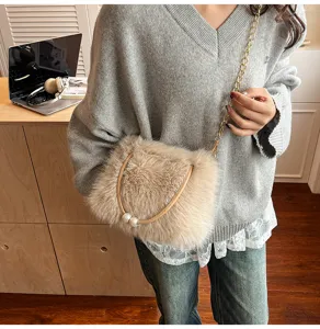 Detailed view of women plush crossbody bag, fluffy faux fur purse with chic pearl chain.