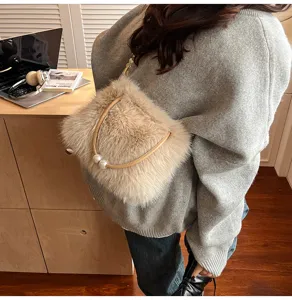 Fuzzy plush shoulder bag for women, cozy winter crossbody handbag with elegant pearl handle.