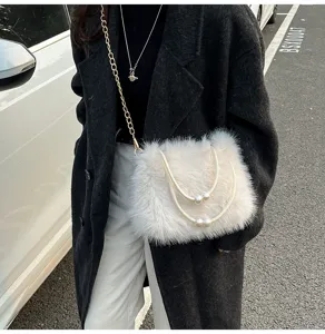 Fluffy plush crossbody bag for women, featuring elegant pearl handles and gold chain strap.