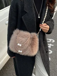 Fluffy faux fur shoulder bag with elegant pearl strap design, stylish winter crossbody bag.