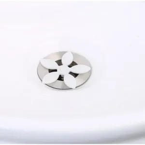 White flower drain hair catcher for kitchen sink and bathroom anti-clogging filter tool.
