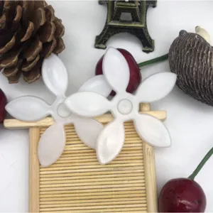 White flower drain hair catcher sink pipe cleaning tool for bathroom and kitchen.