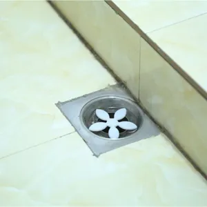 White flower shape hair catcher for shower drain, silicone strainer plug, anti clogging tool.