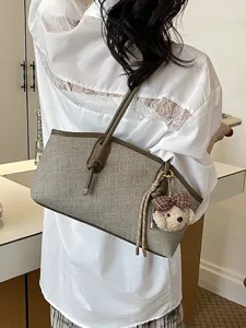Schicke koreanische Schulter-Bagett-Tasche für Damen, lässige Handtasche mit Bärenanhänger.