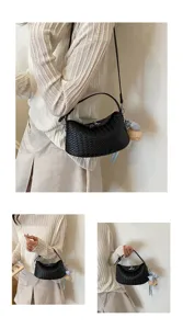 Detailed view of the black woven leather handbag, showcasing exquisite intrecciato texture.
