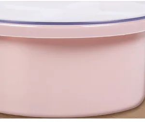 Close-up detail view showing the smooth pink finish of the round kitchen container.