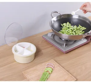 Detail view of round 4-grid kitchen seasoning box with clear lid for condiment storage.