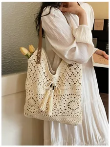 Bolso de hombro tejido de algodón de ganchillo para mujer, bolso de playa hueco con borlas.