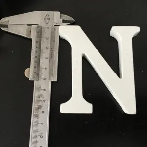 White wooden letter N ornament for home wedding decor and photography props detail