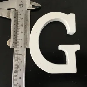 White wooden letter G detail shot, size measurement display with caliper for home and wedding decor.