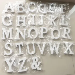 Set of white wooden alphabet letters A to Z and ampersand symbol for home decor photography.