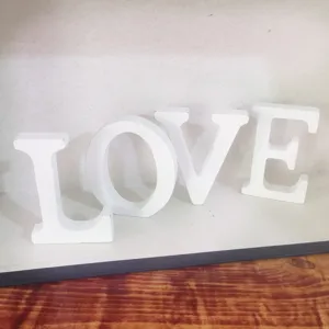 White wooden LOVE letters decorative sign for home wedding decor and photography props.