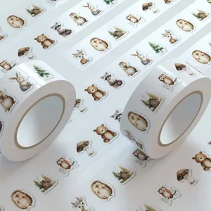 Watercolor forest animal washi tape roll, cute stickers detail view, DIY craft decoration.