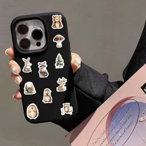 Detailed view of cute forest animal stickers featuring cute bears and rabbits on phone.