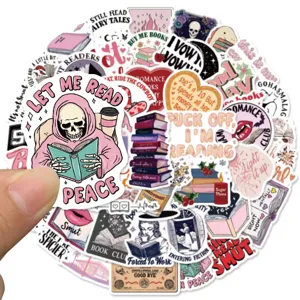 Close-up view of waterproof aesthetic reading stickers featuring cute skulls and book designs.