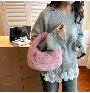 Stylish pink fluffy underarm bag detail shot, soft plush material, trendy daily shoulder bag.