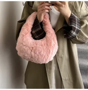 Fluffy pink handbag for women, soft plush hobo tote bag, stylish everyday shoulder purse.