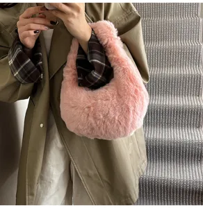 Pink plush handbag for women, soft furry hobo shoulder bag, cute winter fuzzy purse detail.