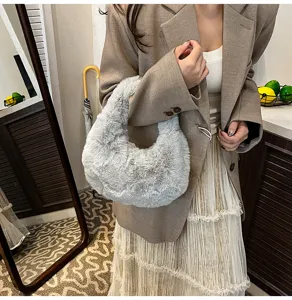 Cozy grey fluffy hobo bag detail shot, soft faux fur texture for women winter fashion style.