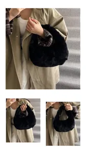 Detailed view of women's black plush handbag, soft furry texture design for daily outfit style.