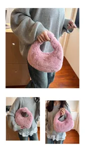 Detail view of the pink fluffy handbag, showcasing soft plush texture and stylish design.