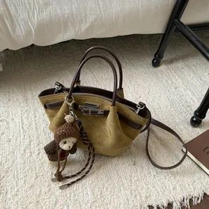 Korean vintage suede shoulder crossbody handbag with cute bear charm and metal clasp.