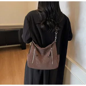 Retro brown shoulder bag for women, large capacity suede crossbody commuting bag.