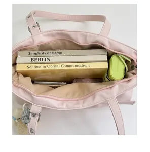 Top-down view showing the spacious interior and large capacity of the pink women shoulder bag.