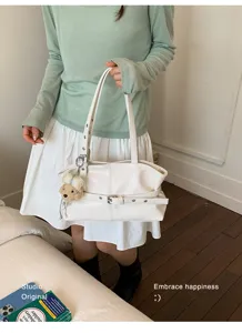 Casual large capacity women shoulder underarm tote bag stylish commuting white handbag with charm.