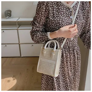 Small woven handbag for women, stylish top handle crossbody bag with strap, summer casual chic style.