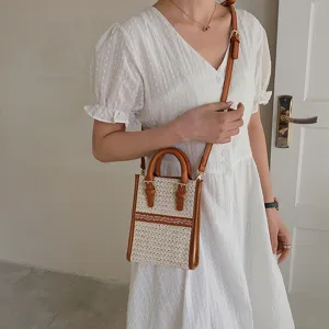 Women summer woven mini handbag with brown leather handle and crossbody strap fashion style main view