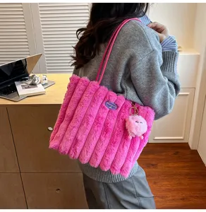 Detail view of pink fluffy tote bag showing soft plush texture and large capacity design.